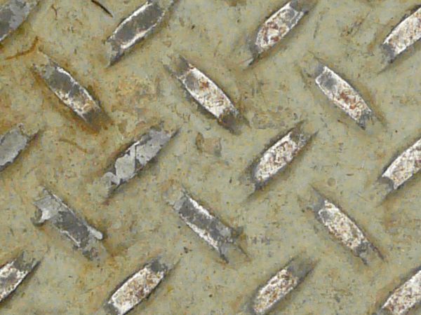 Texture of aged, metal tread with repeating patterns and very worn, dirty surface.